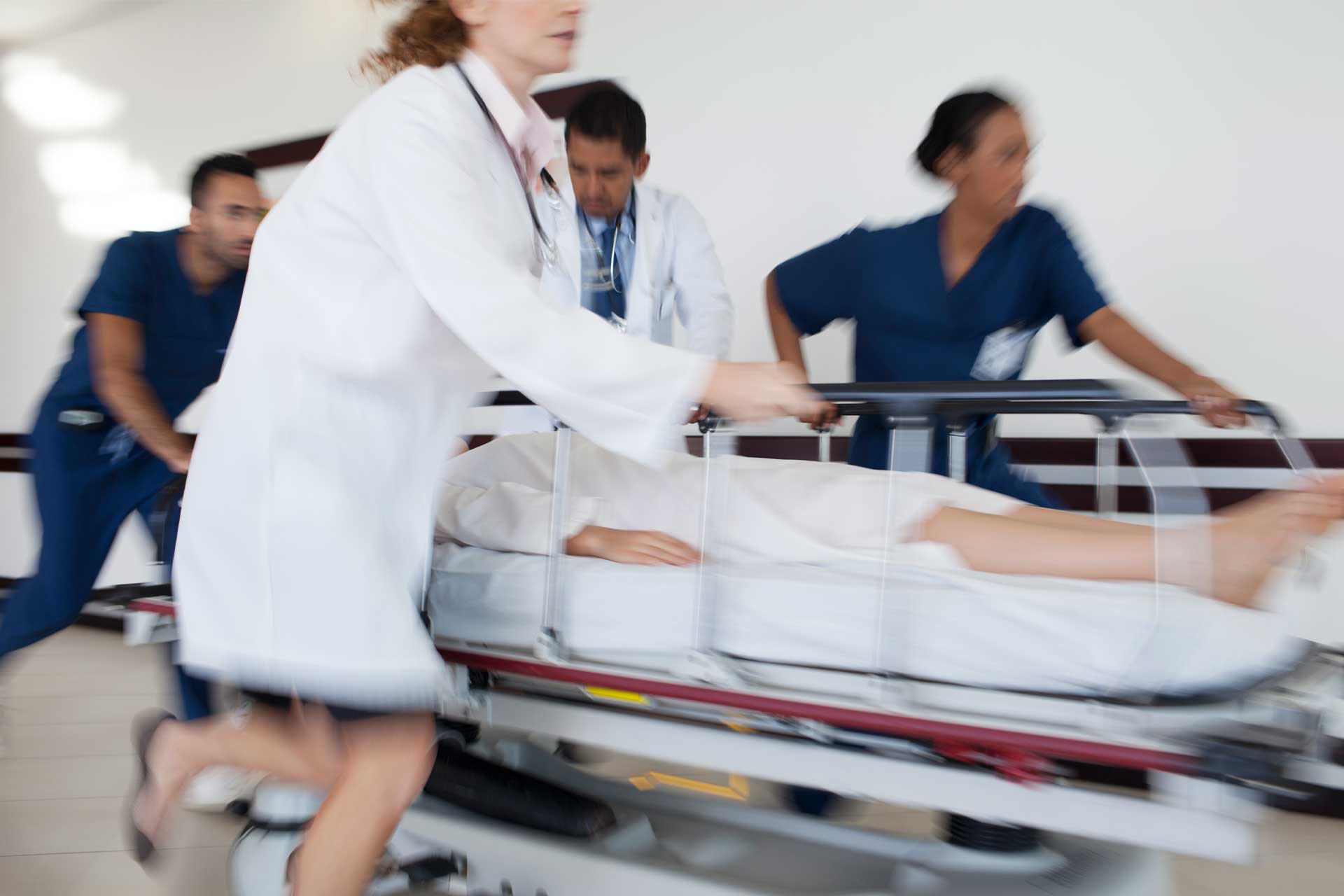 doctors rushing patient emergency