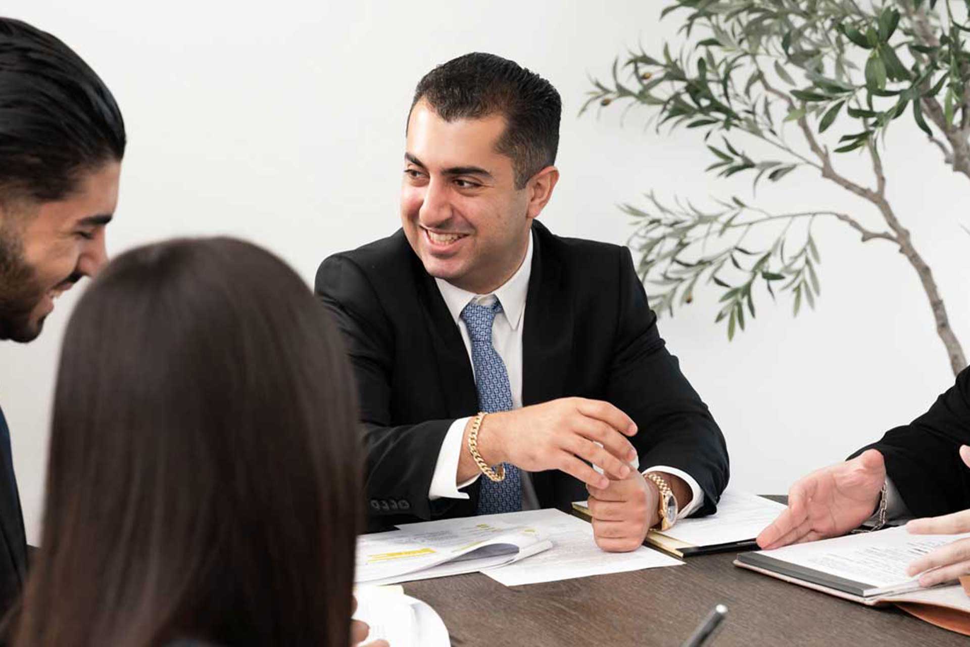 morris chichyan personal injury lawyer consulting with clients in glendale california office