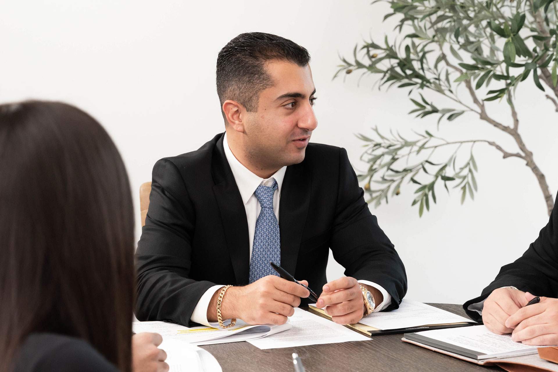 morris chichyan meeting with clients at conference table discussing case